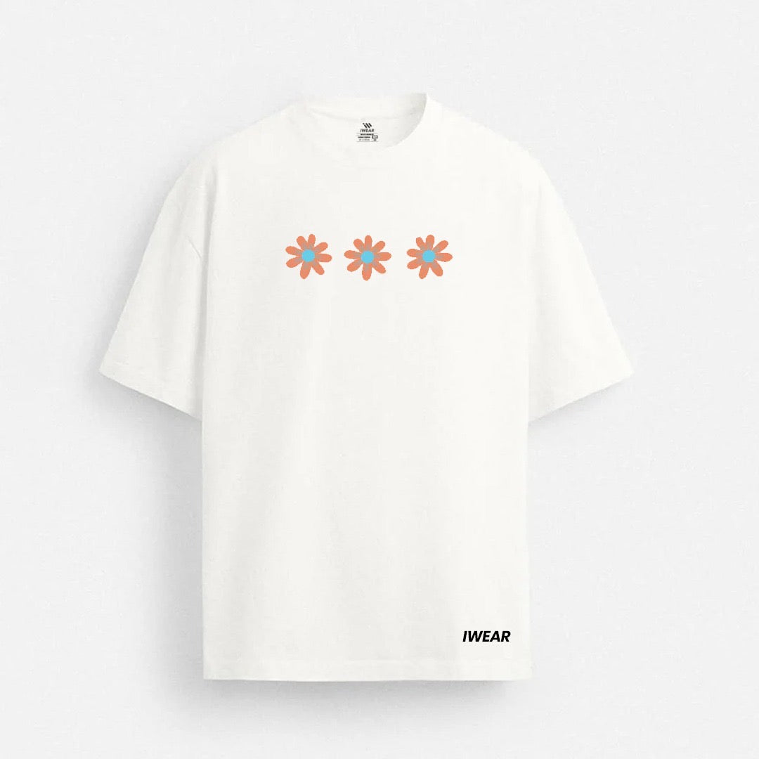 Oversized floral tee by theiwear featuring vibrant floral print and relaxed fit, displayed on a white background.