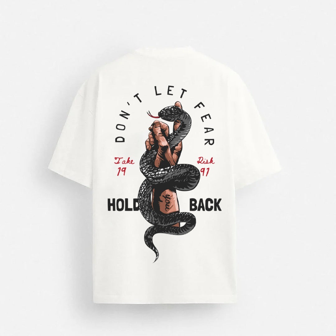 Light grey drop shoulder tee from the theiwear brand with "Don’t Let Fear Hold Back" printed on the front.